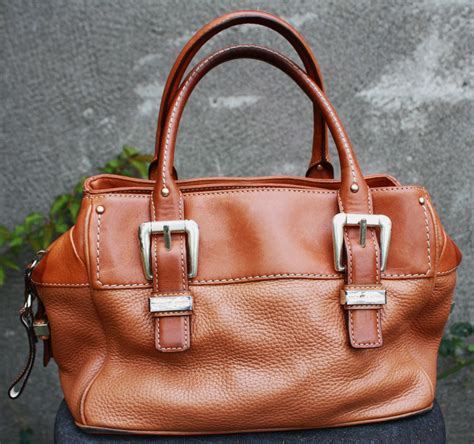 2010 vintage michael kors side pocket leather|Michael Kors bag.